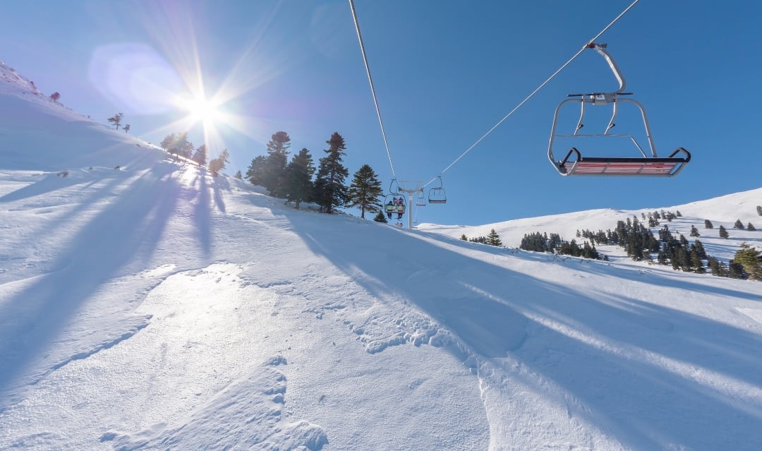 Where in Greece can you swim and ski in one day?