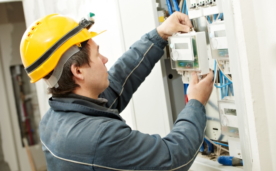 An electrician connects up a home in Cyprus