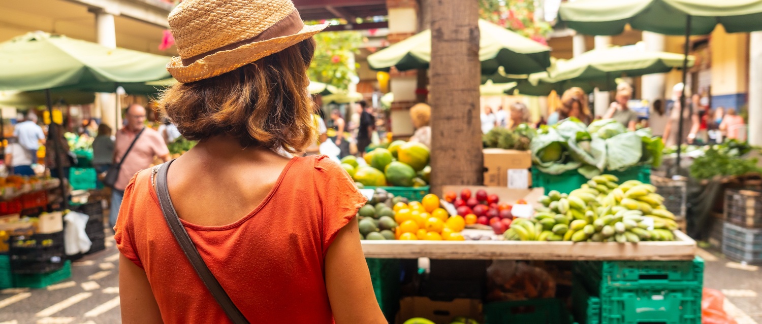 A tourist at the famous Farmers Market in Madeira's city of Funchal Portugal