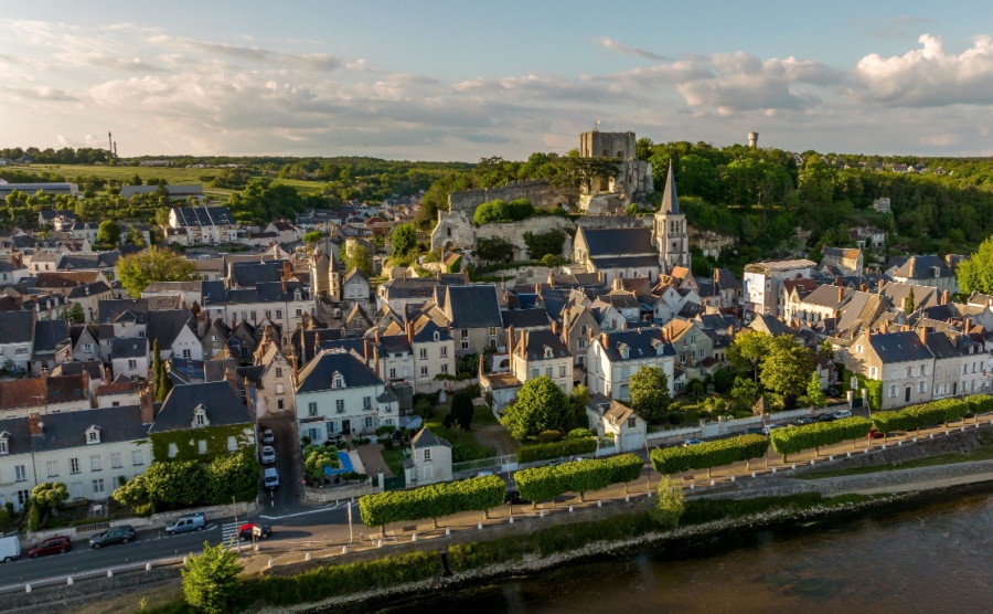 Aerial view of Montrichard castle and town in the Loire Valley with ruined keep and walls on a hilltop bridge across the river