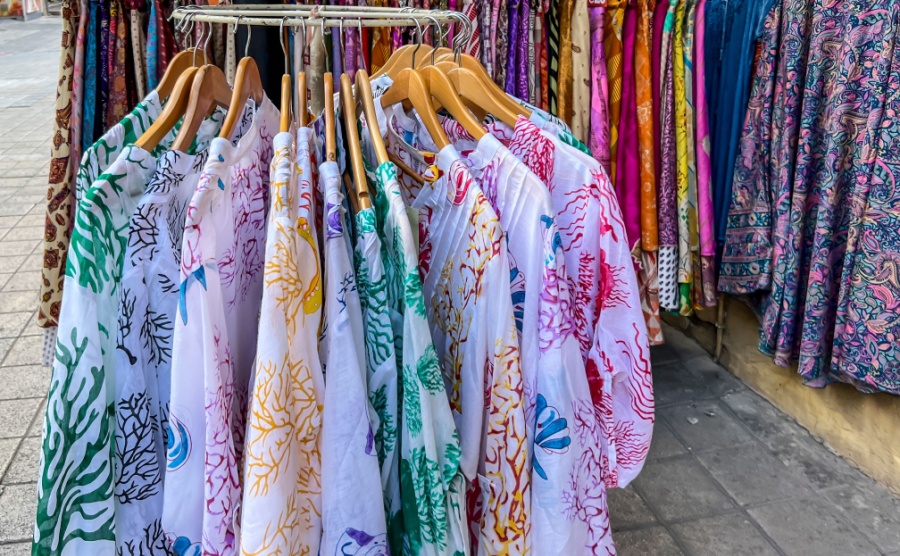 Colorful clothing items such as scarves shawls skirts blouses blankets and others