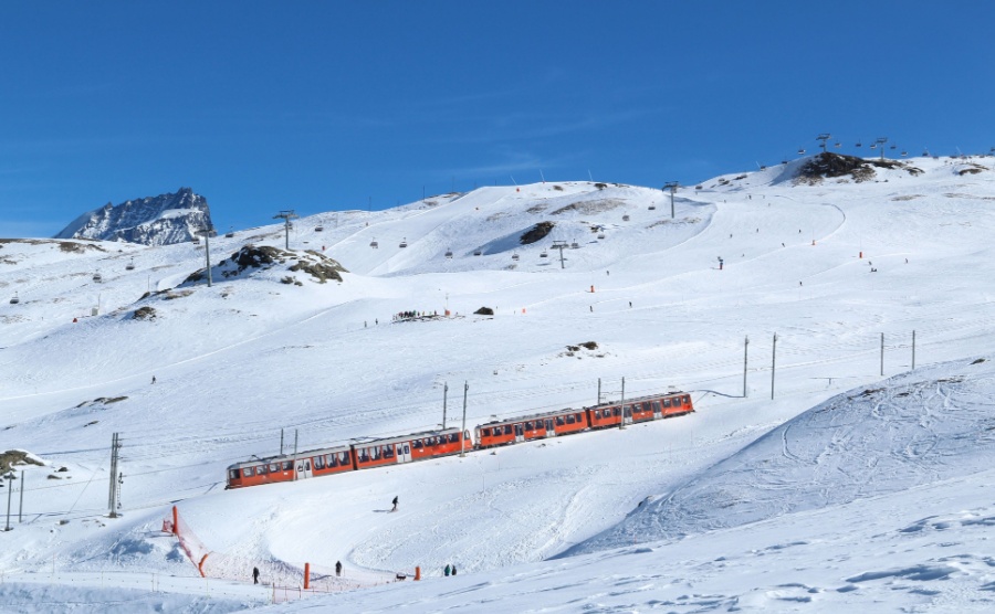 The mountain train from Zermatt up to Gornergrat Ski pistes. Swiss train Switzerland winter.