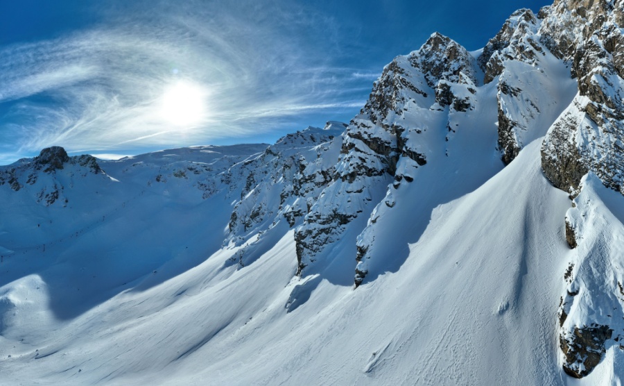 Winter drone shot of ski pistes and slopes covered with fresh powder snow in Tignes in Val D'Isere France