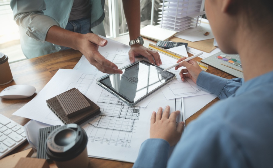 People looking over a building survey report
