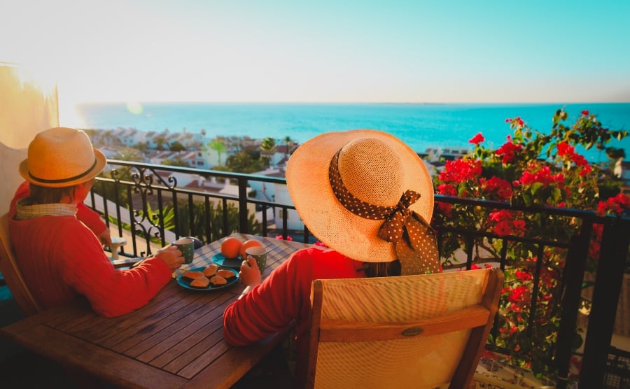 Couple eating on a balcony