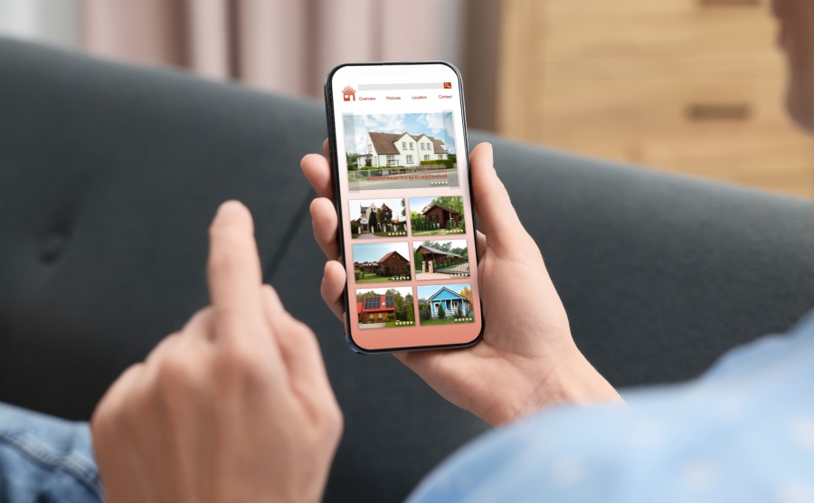 A person house hunting on their phone