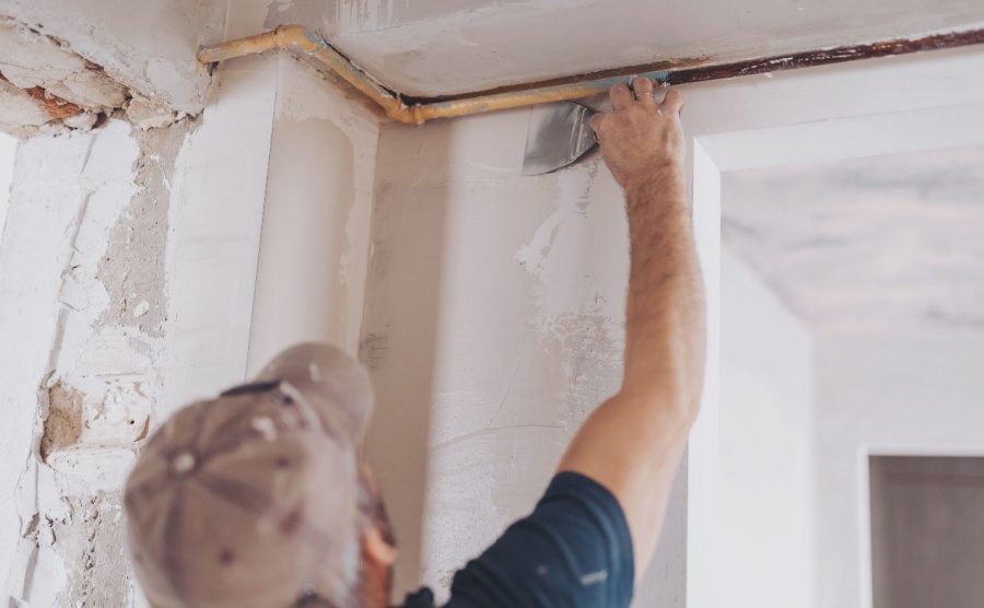 A plasterer renovating a home in France
