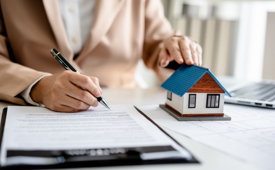 Someone signing a housing contract