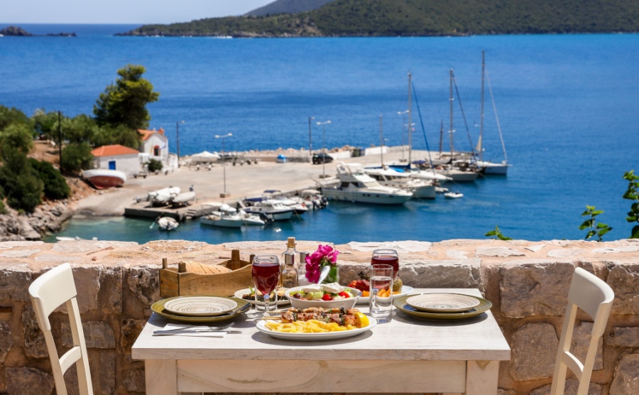 A table served for two with chicken souvlaki and french fries