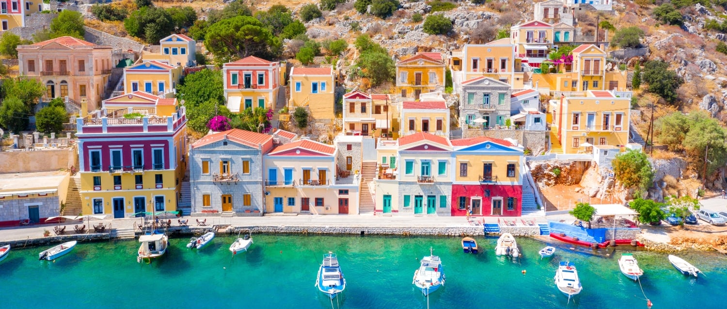 Colourful houses and boats in Greece