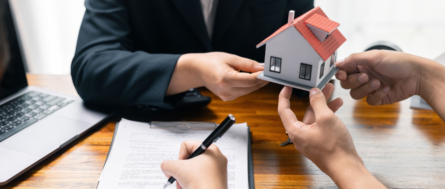 Real estate agent facilitated sale of property through mortgage loan, ensuring smooth investment process for purchaser with help of skilled broker. Concept of loan, insurance, approval, real estate.