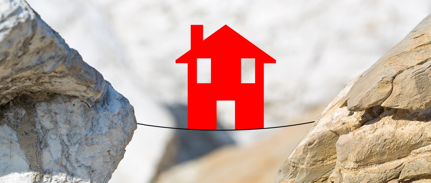 A red property on a highwire string between two rocks