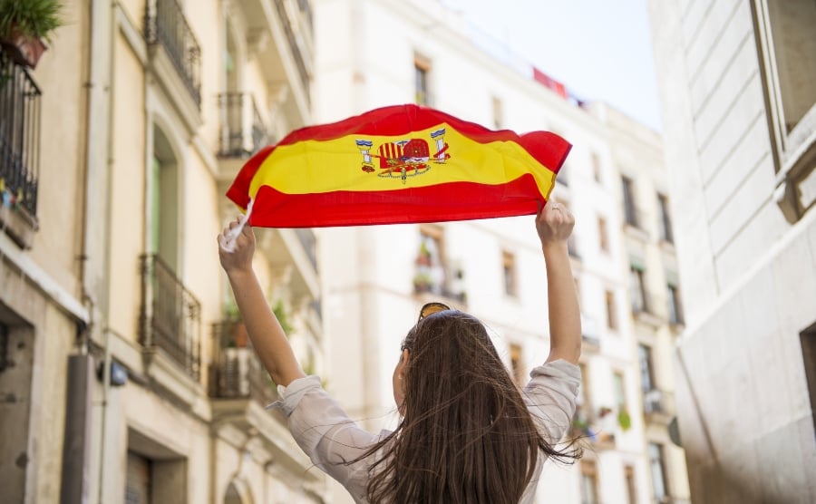 Woman waving flag in Barcelona street