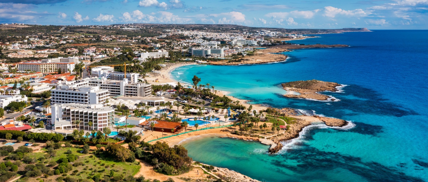 Aerial view of beautiful Nissi beach in Ayia Napa, Cyprus. Nissi beach in Ayia Napa famous tourist beach in Cyprus. A view of an azure water and Nissi beach in Aiya Napa, Cyprus.