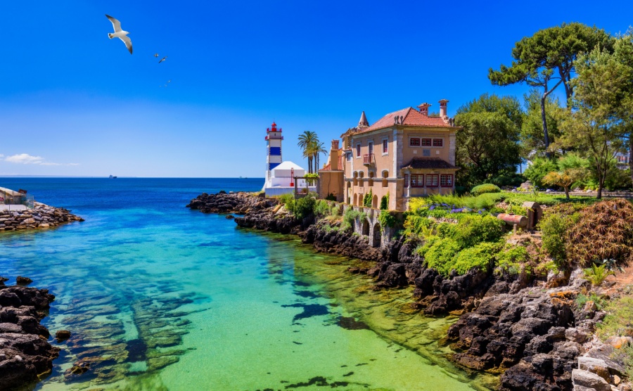 Santa Marta lighthouse and Municipal museum, Cascais, Lisbon, Portugal. Lighthouse Museum of Santa Marta in Cascais Portugal, as seen from Santa Marta Beach on a beautiful day. Cascais, Portugal.