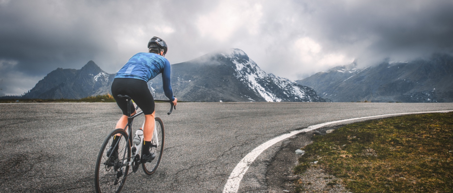 Road cyclist cycling in the Alps on their road bike