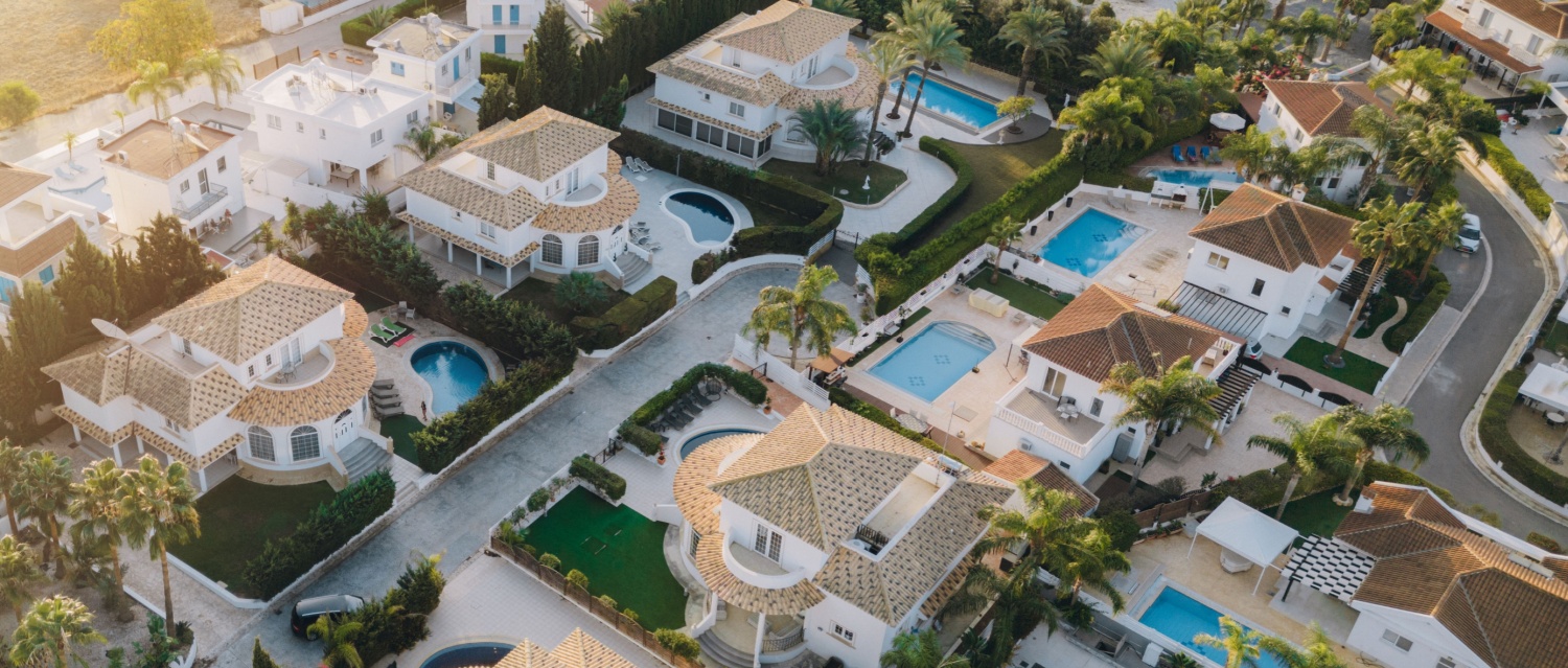 Drone aerial view to residential area with luxury cottages, houses in Aya Napa, Cyprus
