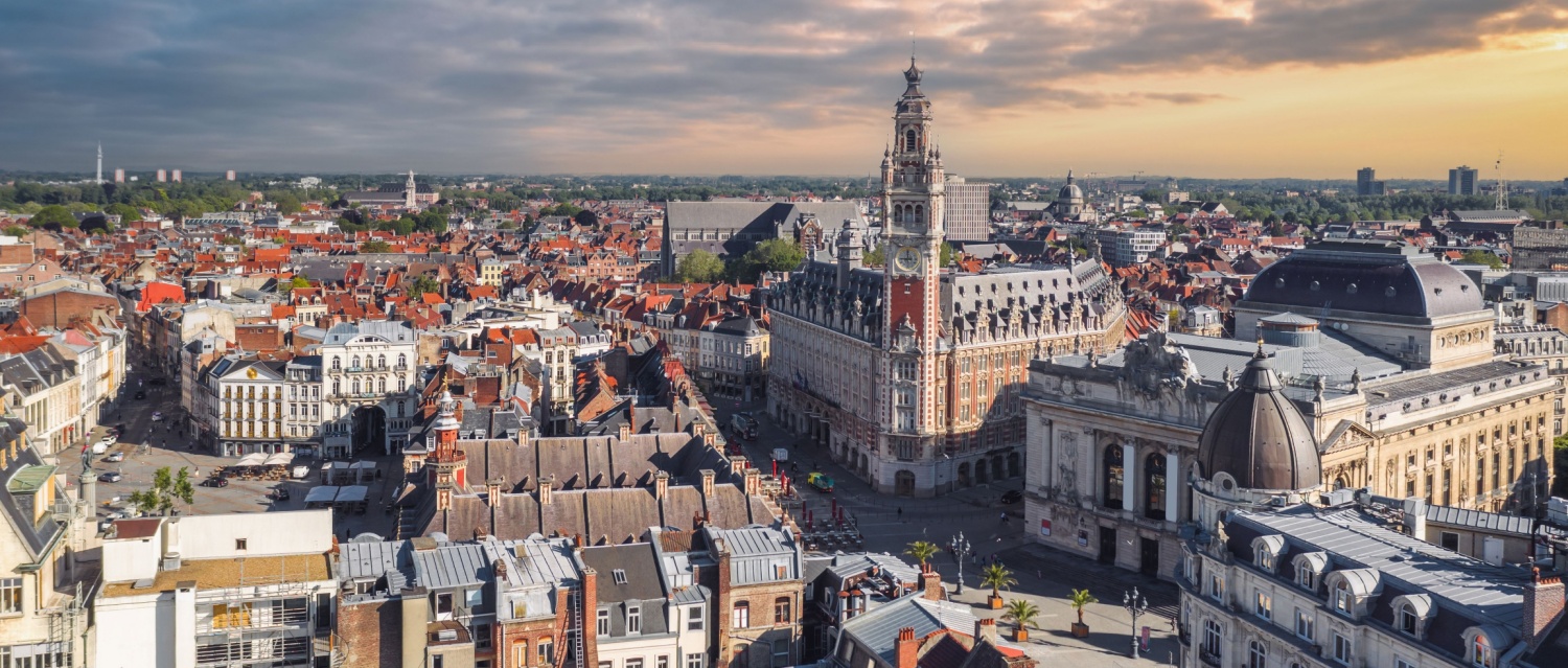 Cityscape of Lille (Hauts-de-france, Flanders, France) at sunset: Aerial skyline view of the historical Grand Place du Général-de-Gaulle, old town main square.