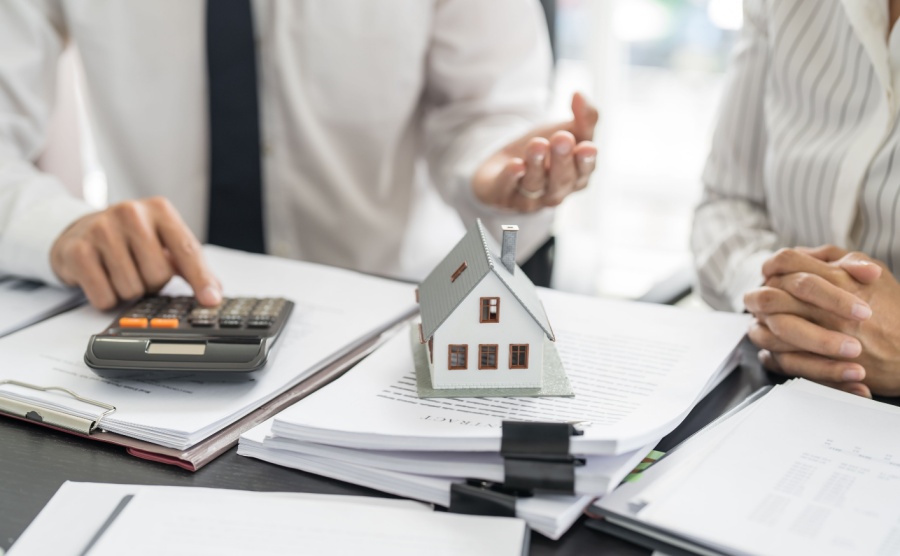 Business people signing contract making deal with real estate agent Concept for consultant home insuranceReal estate investment Property insurance security. Real estate agent.