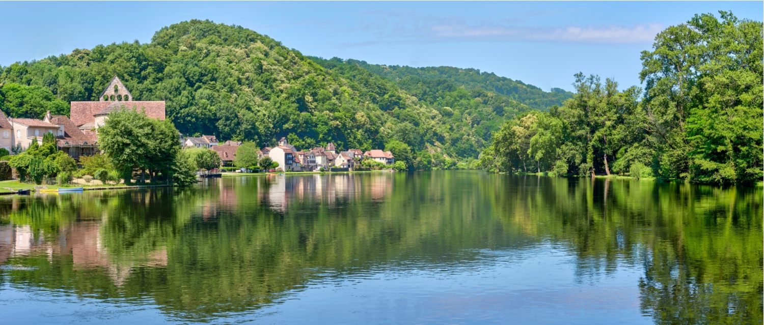 Panorama of the village of Beaulieu-sur-Dordogne and the Dordogne river in Corrèze Nouvelle-Aquitaine in Southern France on a sunny day in summer
