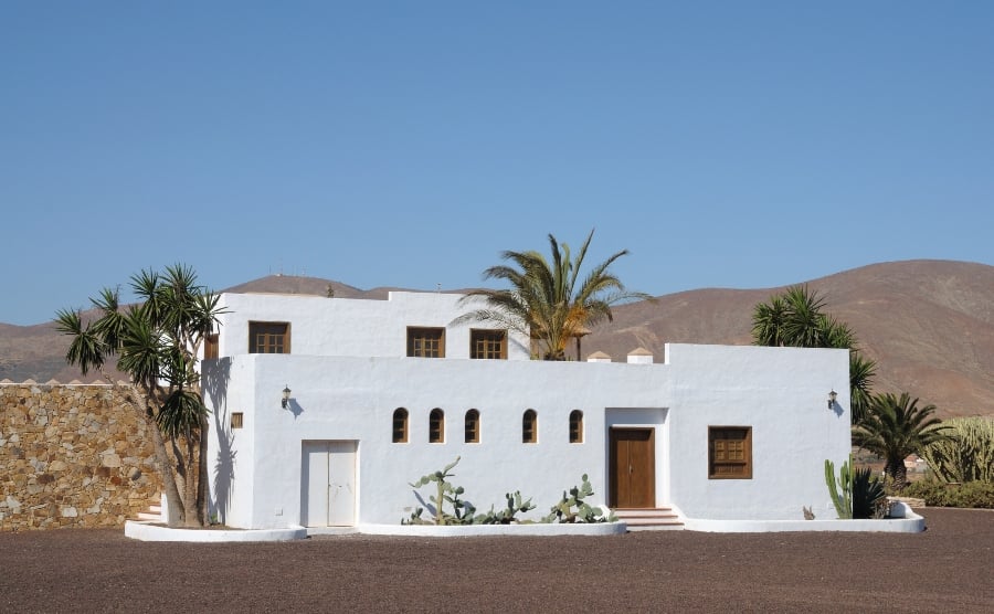 White house with volcanic landscape