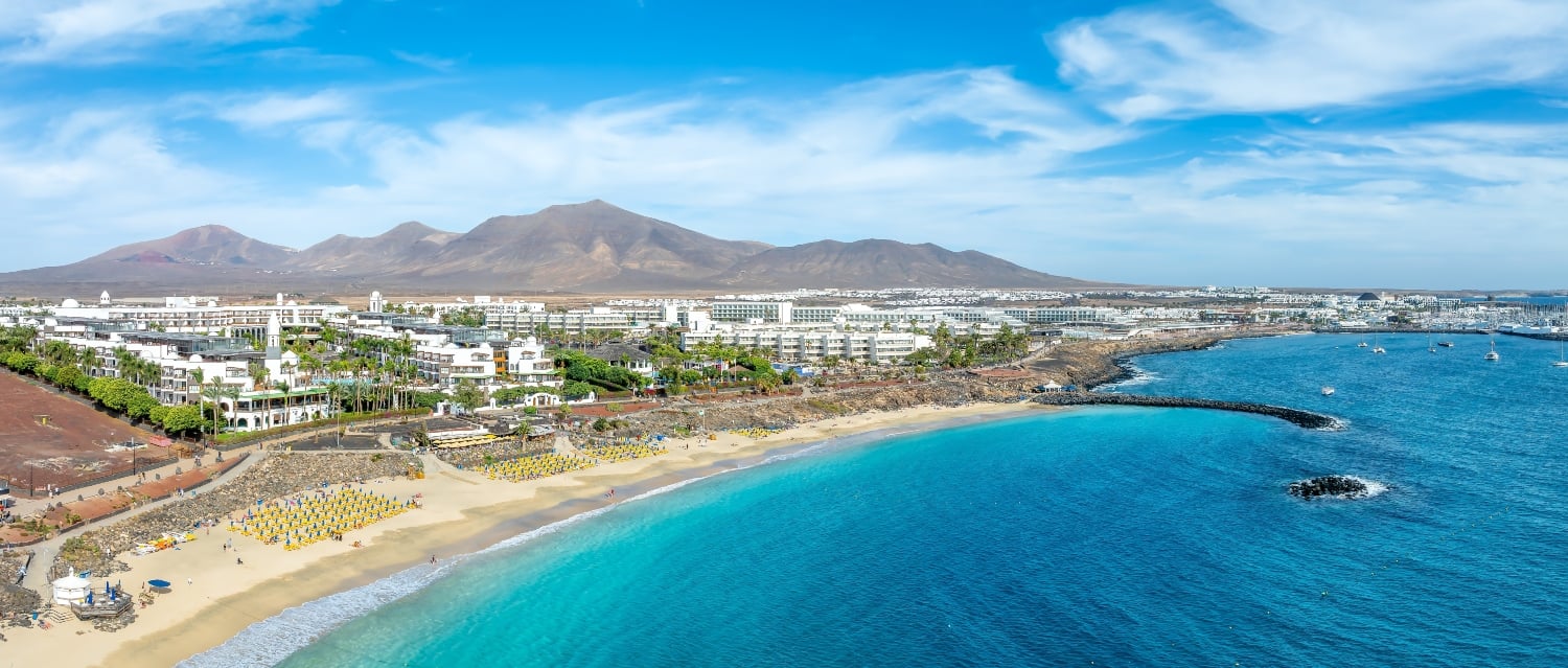 Beach, houses and mountains in Lanzarote