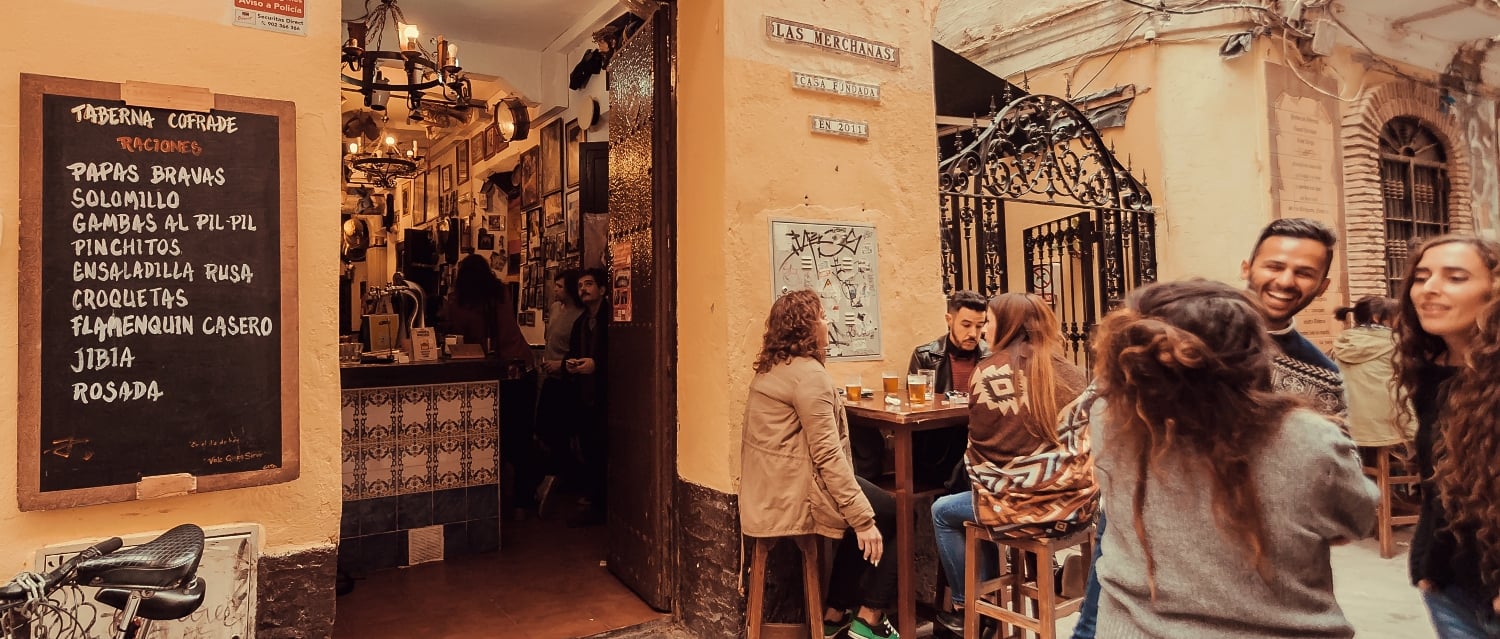 Locals outside a tapas bar in Malaga