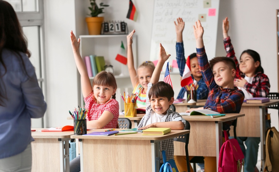 Little children during lesson at language school