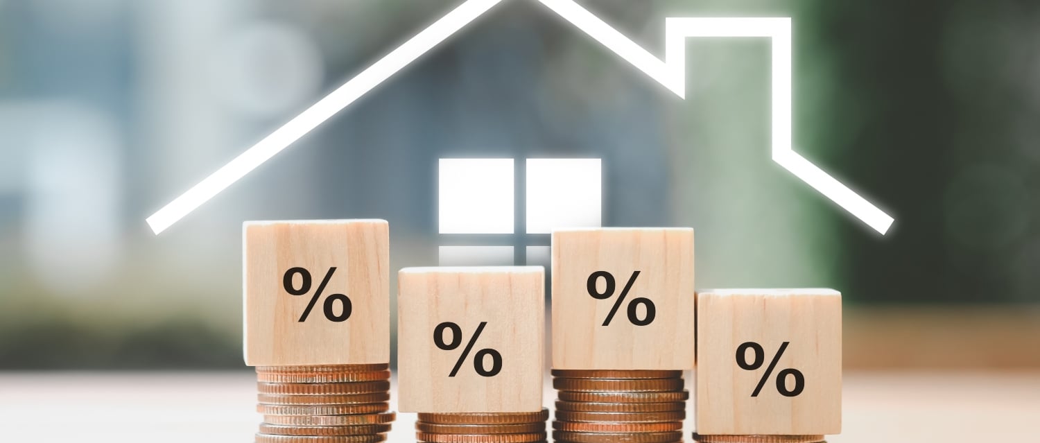House icon with stacks of coins and percentage signs