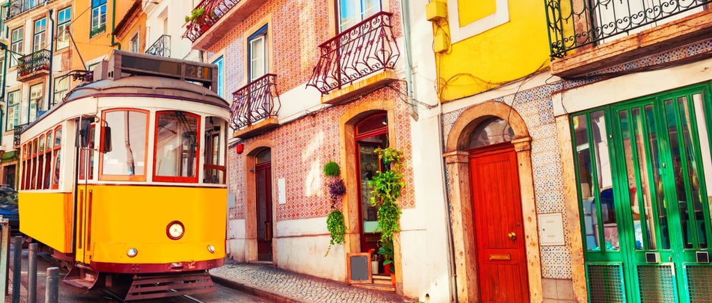 Yellow vintage tram on the street in Lisbon, Portugal. Famous travel destination