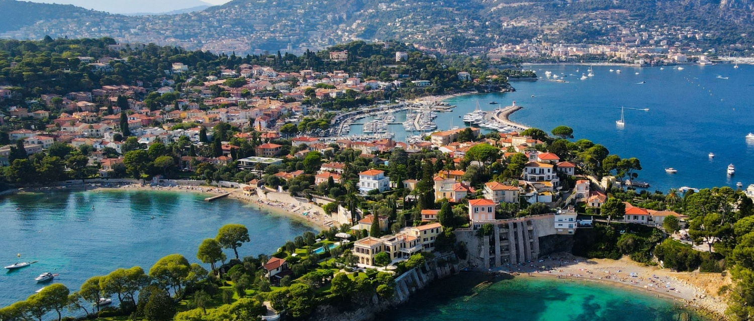 Aerial drone view of Saint-Jean-Cap-Ferrat, French Riviera (Côte d'Azur), France. Birds Eye view of the French Riviera resort town on Cap Ferrat cape with exclusive estates in a perched village.