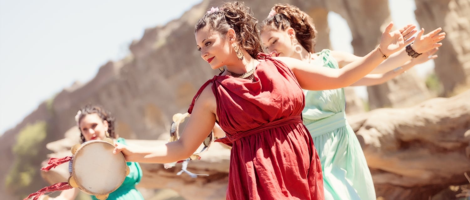 Girls dancing in ancient Greek-inspired costumes