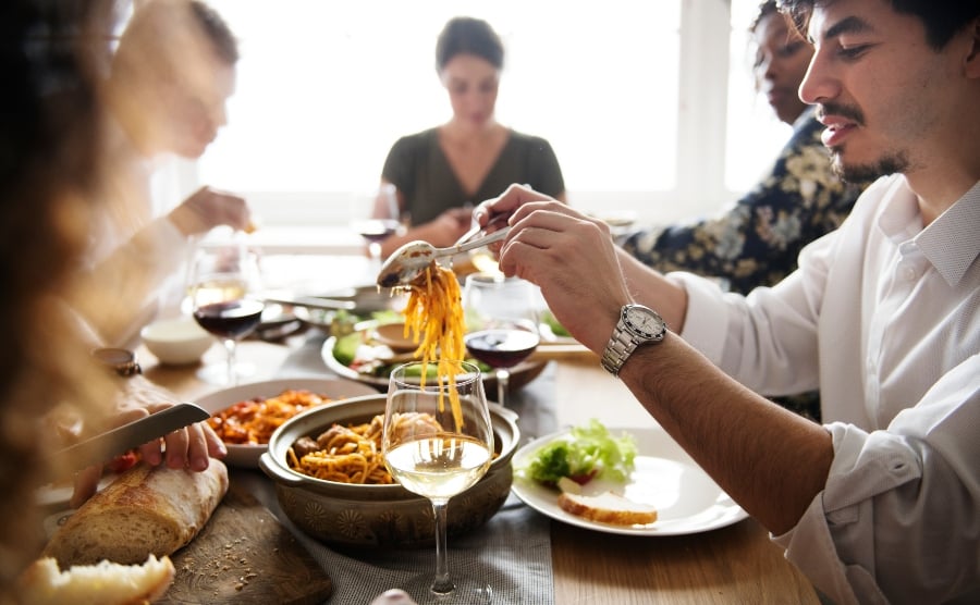 People eating pasta together