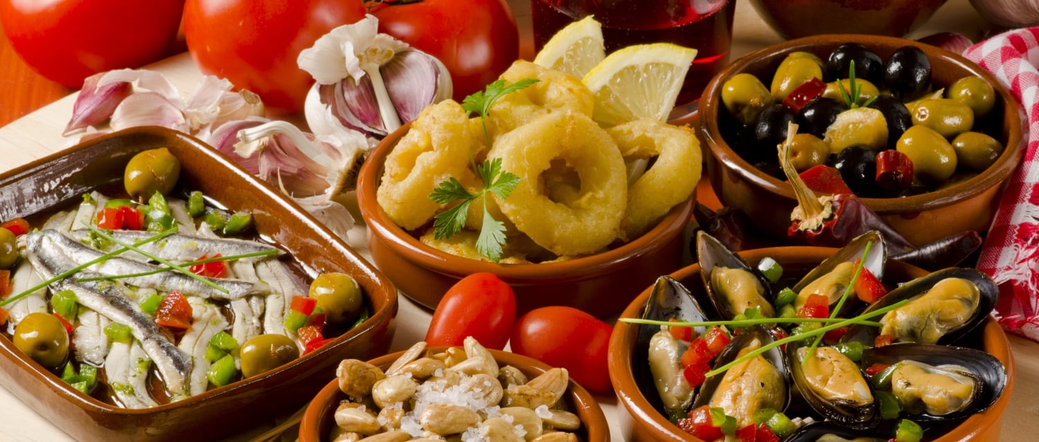 Selection of Spanish tapas with red wine