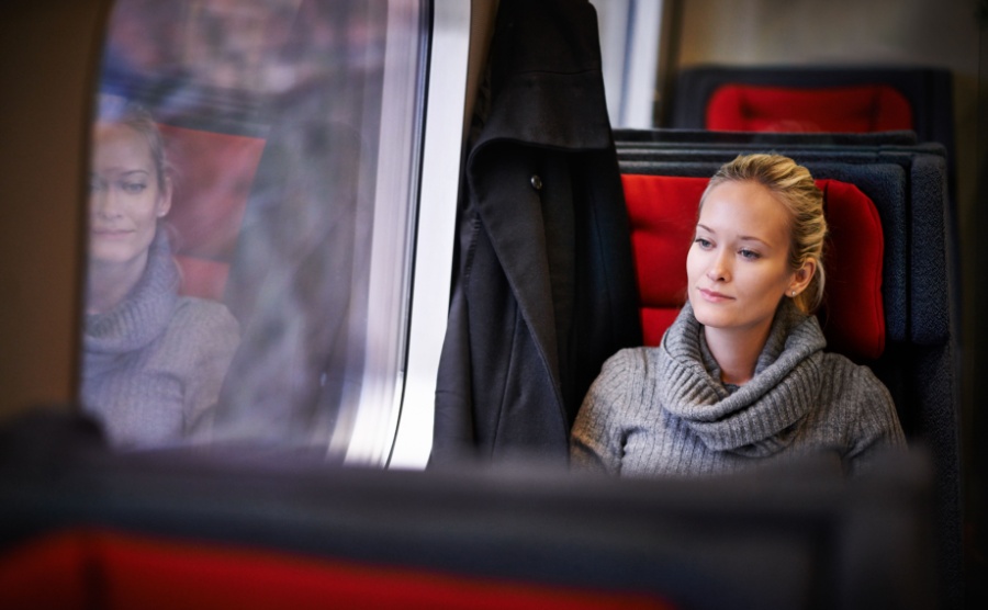 Woman, travel and thinking on train for holiday with adventure, trip and leisure with journey in France. Female person, commute and vacation on public transport as tourist for break and destination