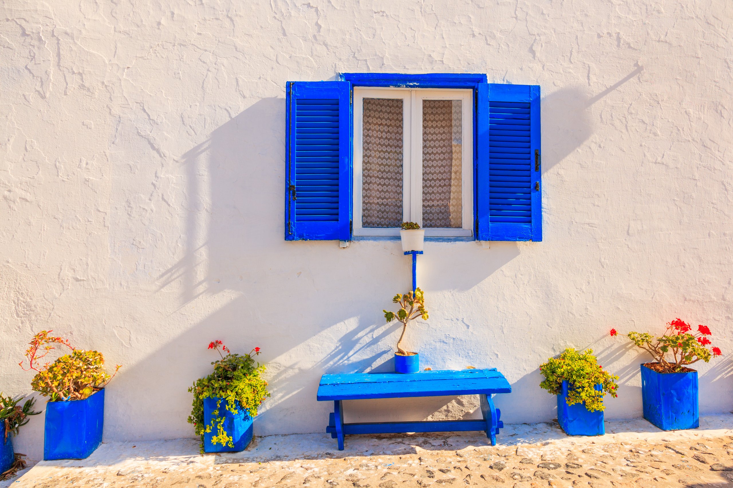 Greece white house with blue shutters
