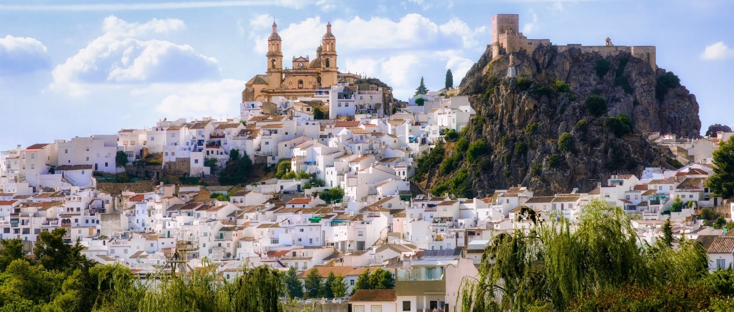 Olvera white village overlooked by church and castle