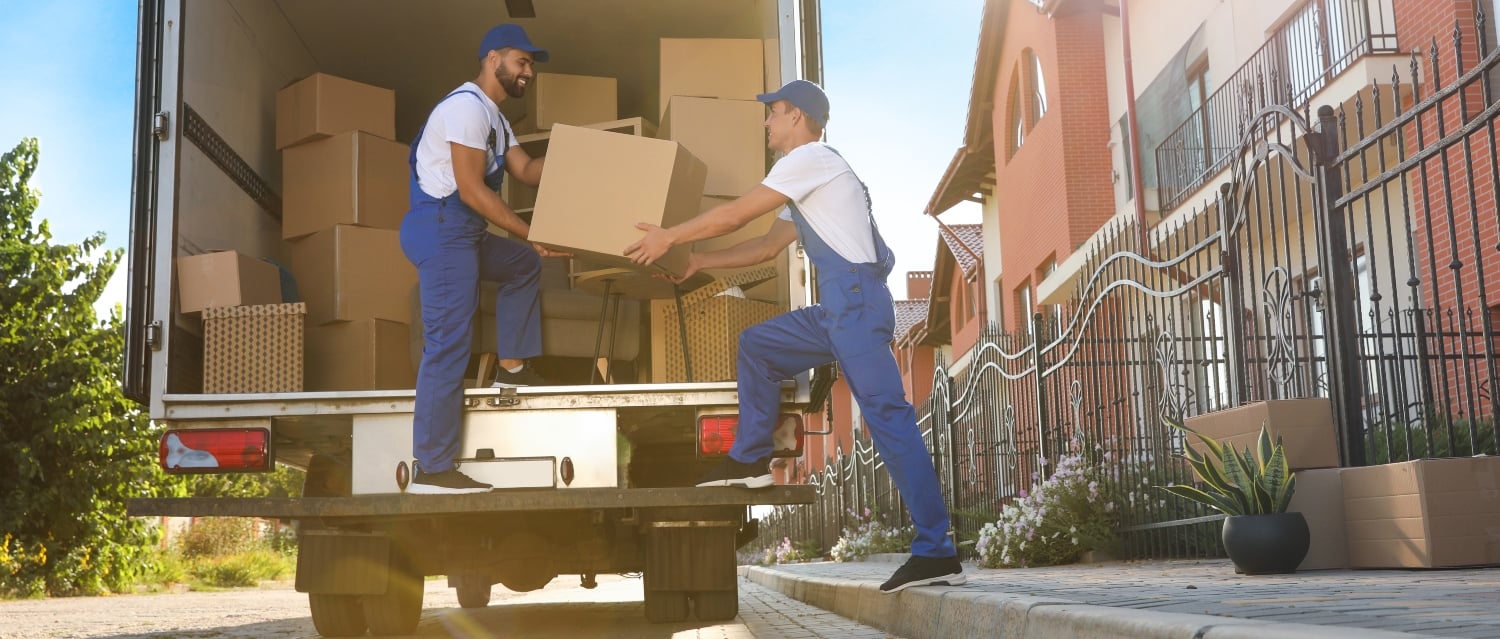 Removal workers loading van