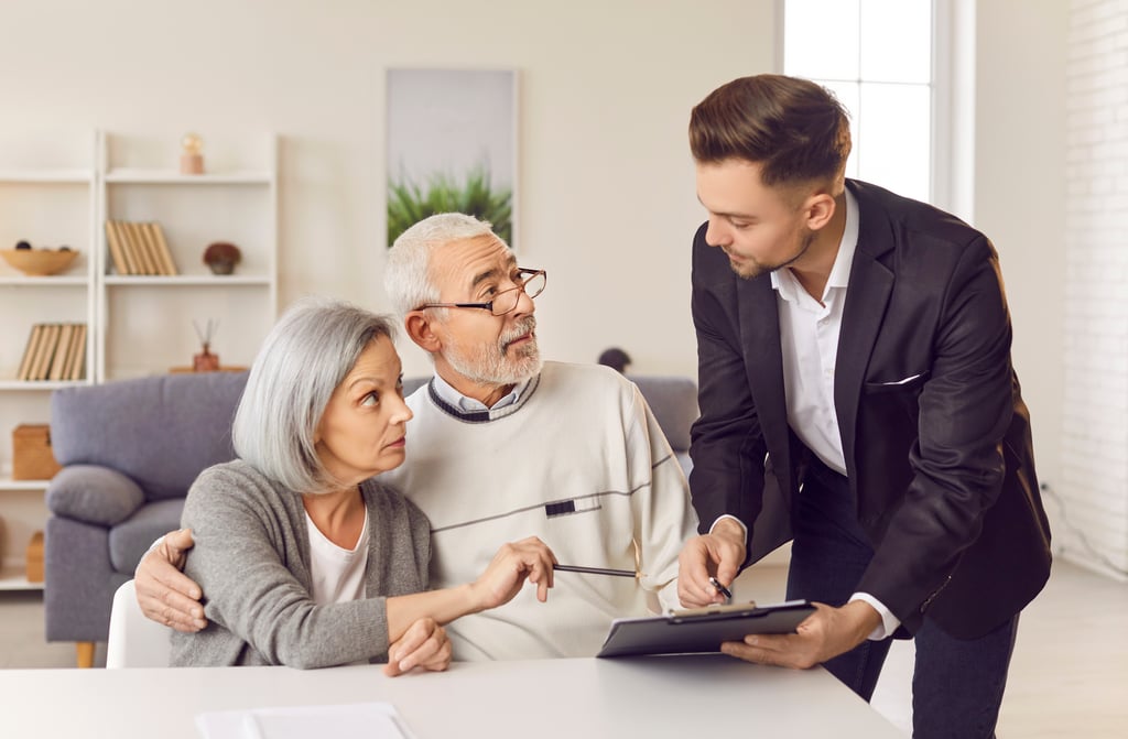Senior couple talking to lawyer