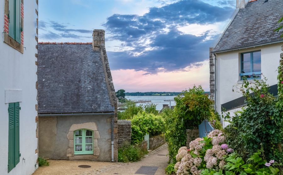 Brittany, Ile aux Moines island in the Morbihan gulf, small street and beautiful house with view of the sea