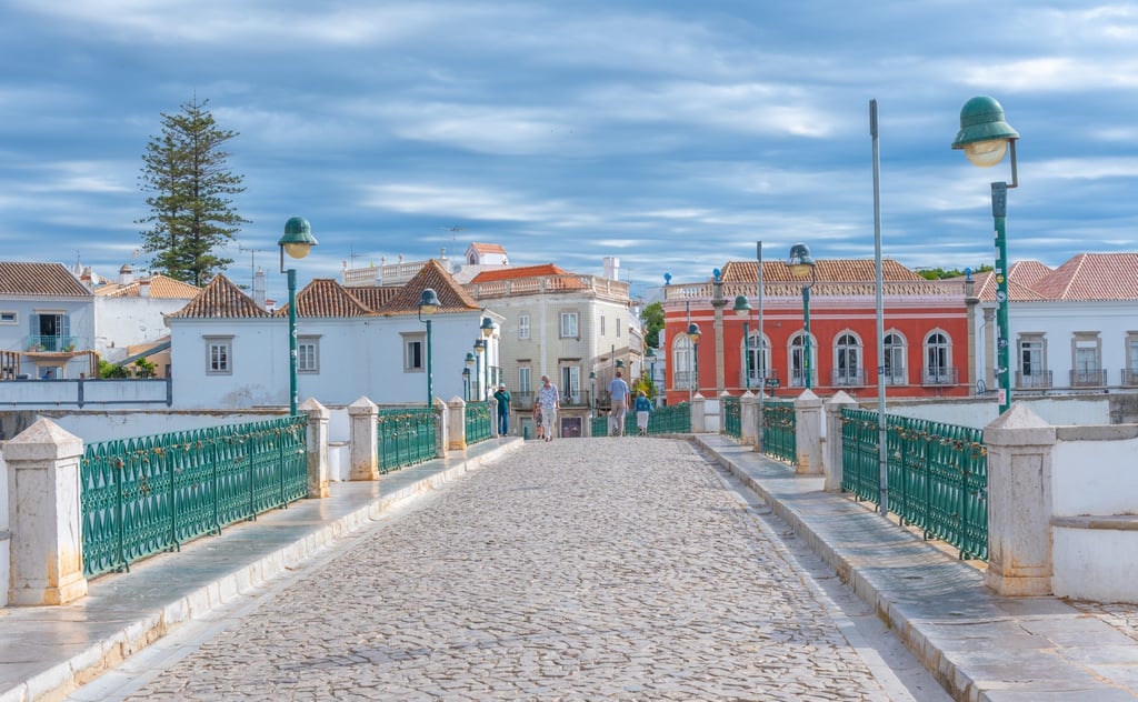 Roman bridge crossing the Gilão river in Tavira, an affordable retirement town in Portugal's eastern Algarve