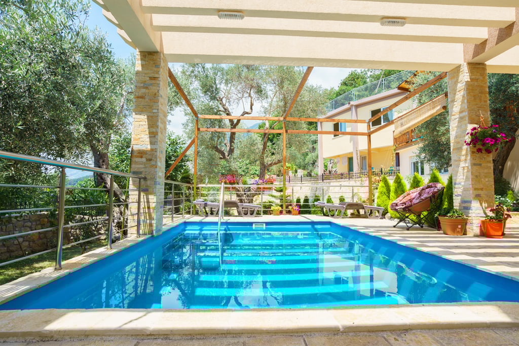 Contemporary timber-clad villa with pool set among umbrella pines in Comporta's signature low-rise architectural style
