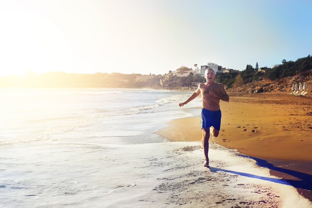 Man running on beach in Cyprus