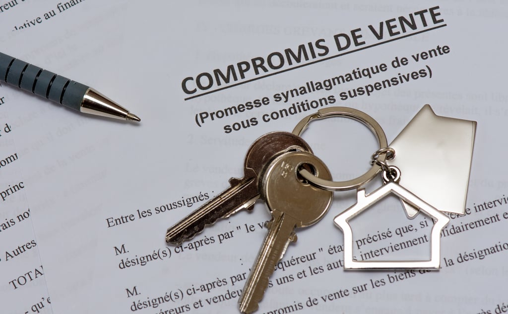Keys resting on a compromis de vente, the preliminary contract signed when buying property in France