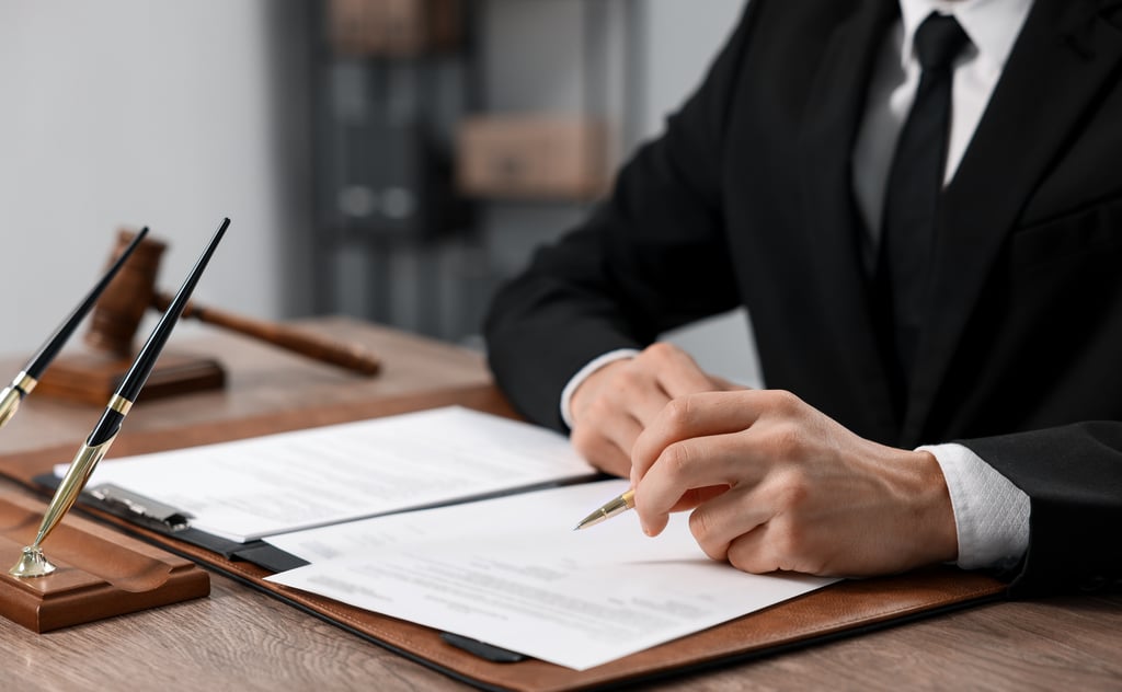 Documents and legal papers on a desk in a French notaire office, representing the capital gains tax process for UK property sellers in France