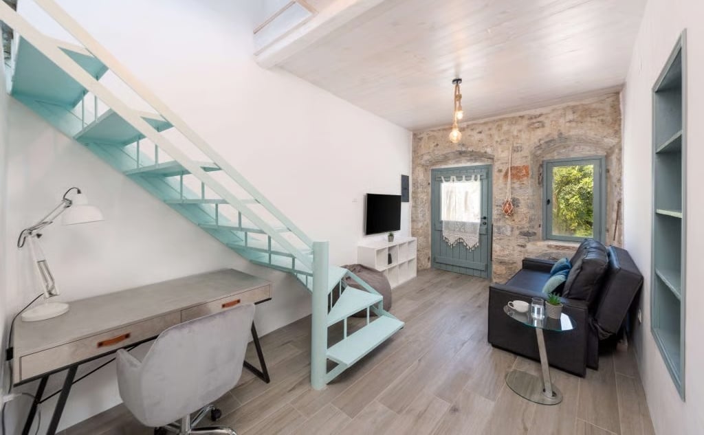 Living room and staircase inside Greek home