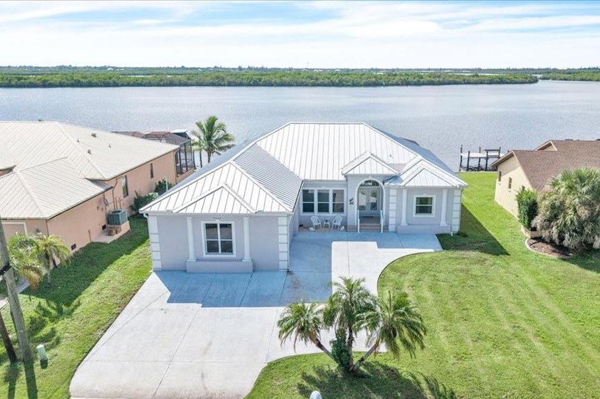 Florida is a land of waterfront properties, both along its two coastlines and within its waterside communities, such as Cape Coral and this one in Port Charlotte where private moorings are standard