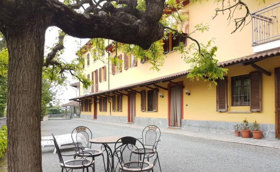 yellow exterior of apartment property in Italy