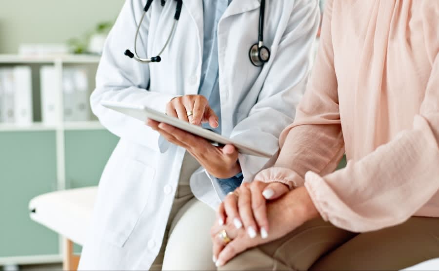 A healthcare professional with a patient