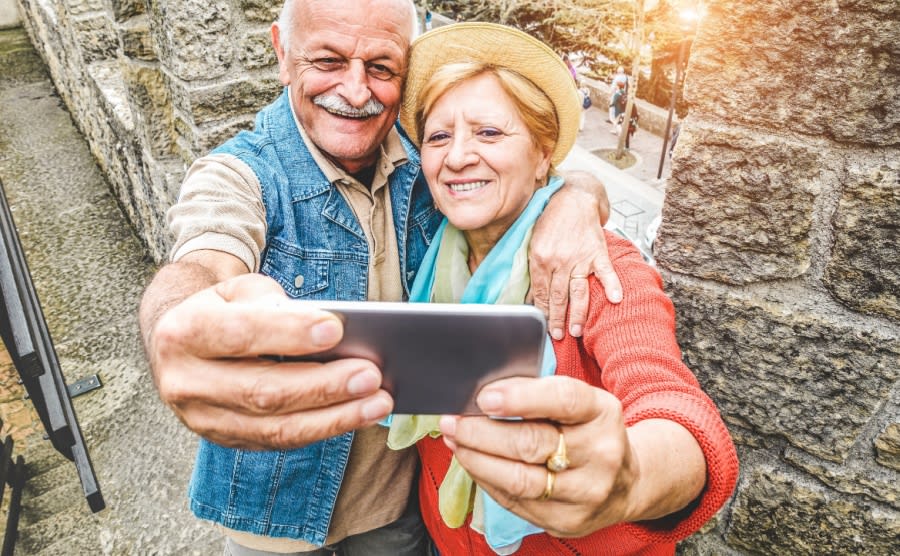 A senior couple taking a selfie